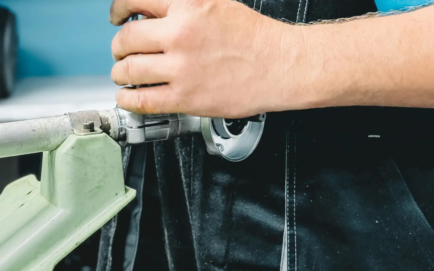 Plumber repairing a pipe with a wrench